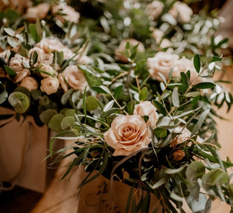 Pink and green wedding bouquets in bags