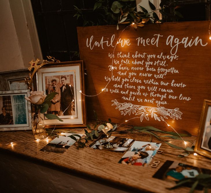 Until we meet again tribute table with family portraits