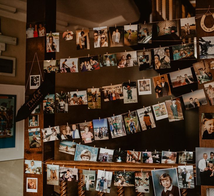 Strung up family pictures of when the bride and groom were younger