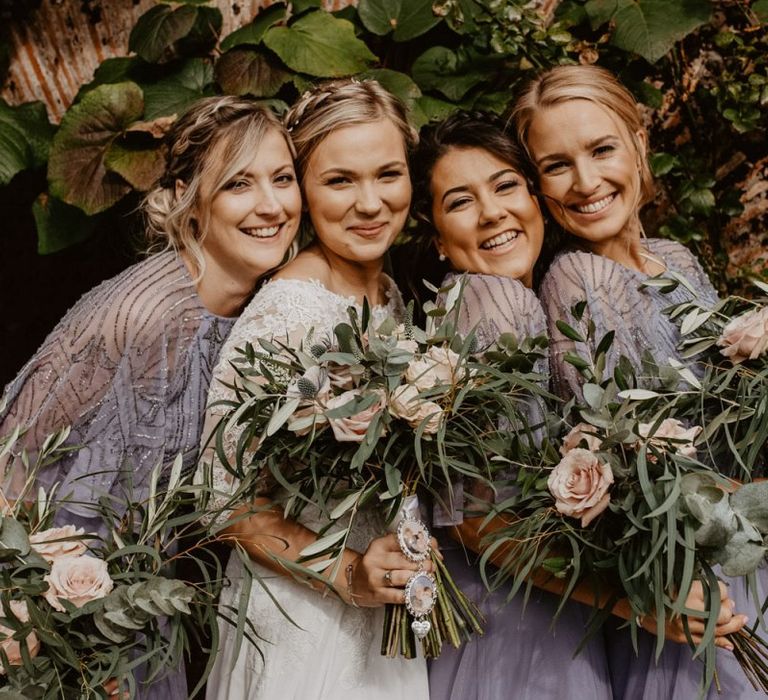 Bridal party portrait with bridesmaids in grey embellished dresses