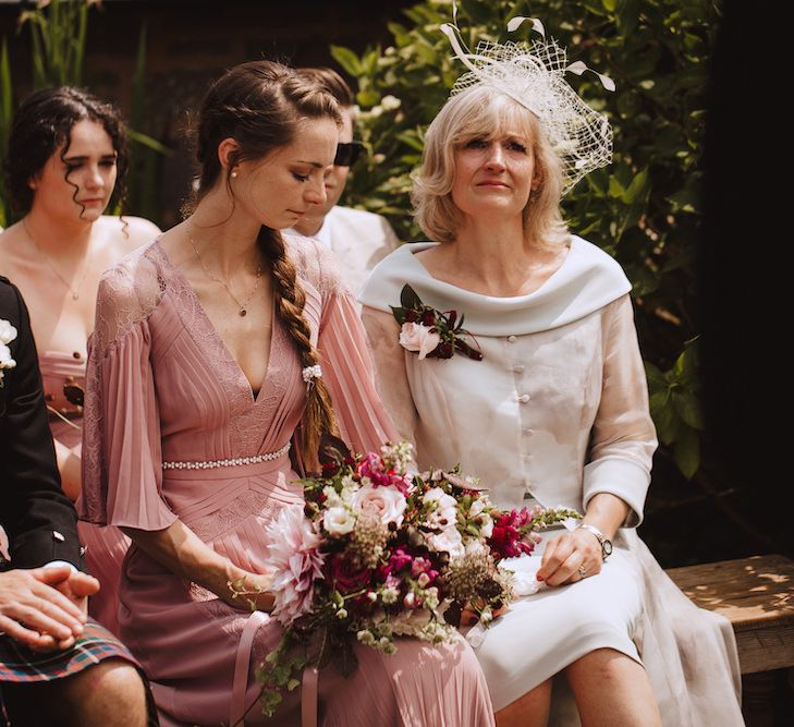 Emotional Mother of the Bride and Sister at the Wedding Ceremony