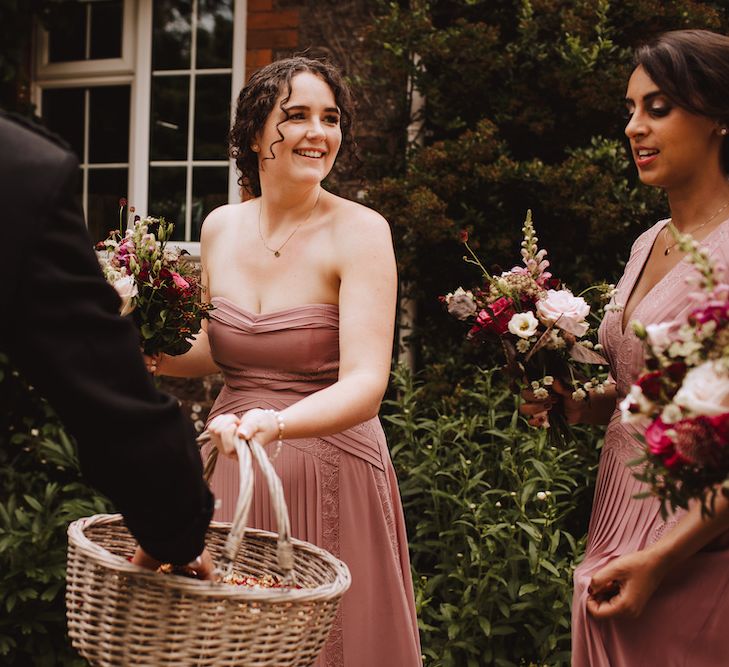 Bridesmaid in Dusky Pink Dress Holding a Confetti Basket