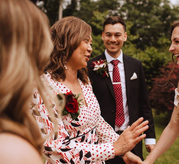 Mother of the Groom and The Bride Laughing Together