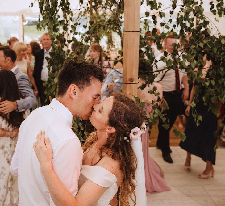 Bride and Groom Kissing on the Dancefloor