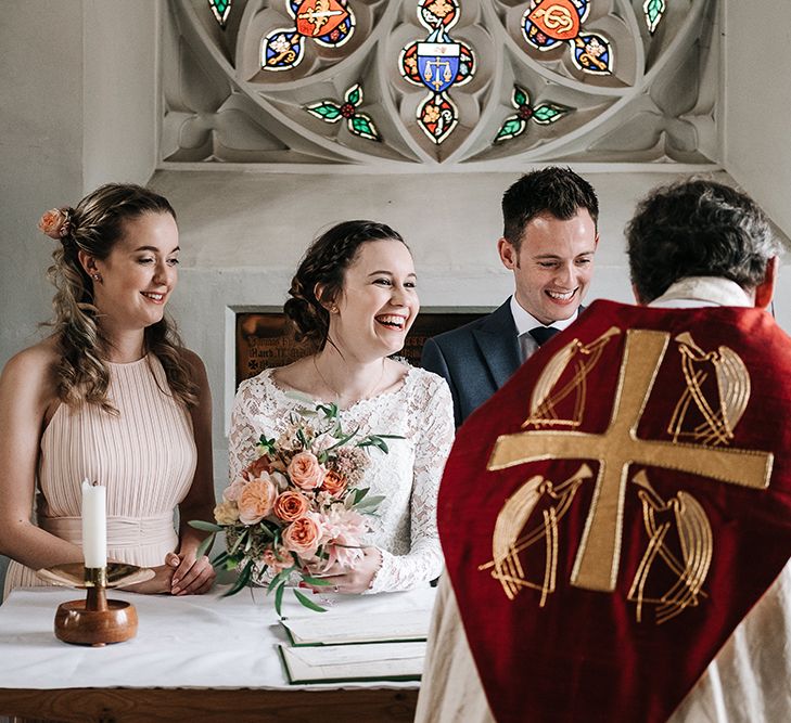 Church Wedding Ceremony | Signing the Register | Bride in Lace Gown | Groom in Next Suit | Peach Wedding at Swanton Morley House and Gardens in Norfolk |  Jason Mark Harris Photography | Together we Roam Films