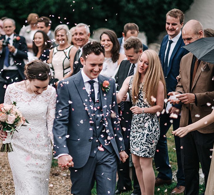 Confetti Exit | Bride in Lace Gown | Groom in Next Suit | Peach Wedding at Swanton Morley House and Gardens in Norfolk |  Jason Mark Harris Photography | Together we Roam Films