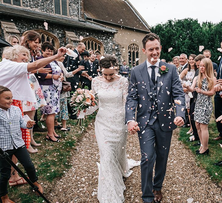 Confetti Exit | Bride in Lace Gown | Groom in Next Suit | Peach Wedding at Swanton Morley House and Gardens in Norfolk |  Jason Mark Harris Photography | Together we Roam Films