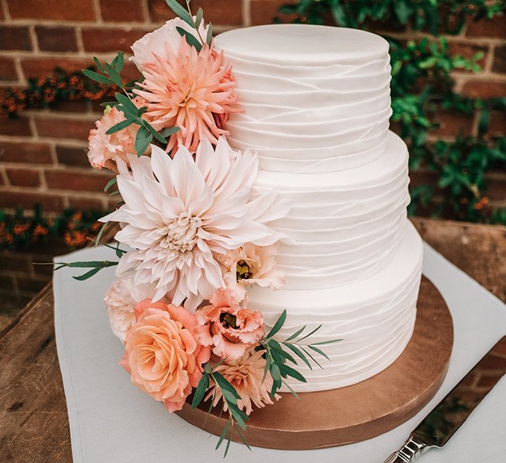 Iced Wedding Cake with Peach Dahlia Flower Decor | Peach Wedding at Swanton Morley House and Gardens in Norfolk |  Jason Mark Harris Photography | Together we Roam Films