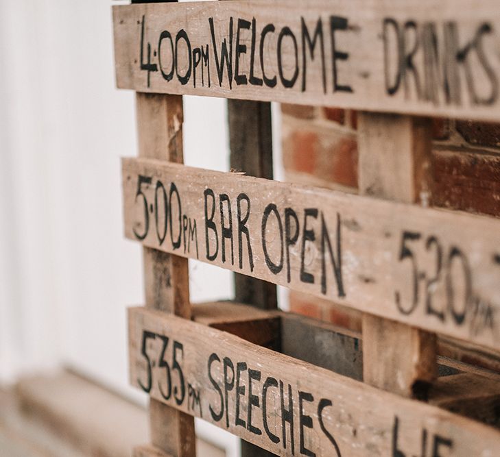 Wooden Palette Order of the Day Sign | Peach Wedding at Swanton Morley House and Gardens in Norfolk |  Jason Mark Harris Photography | Together we Roam Films