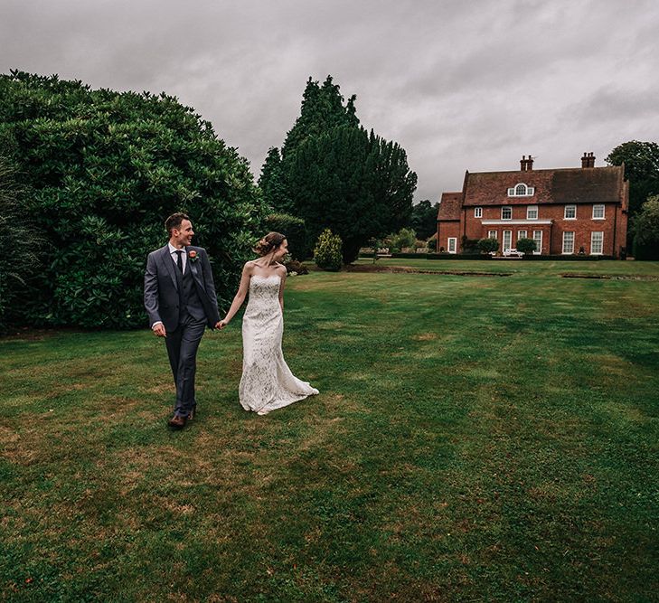 Bride in Lace Wedding Dress | Groom in Next Suit | Peach Wedding at Swanton Morley House and Gardens in Norfolk |  Jason Mark Harris Photography | Together we Roam Films