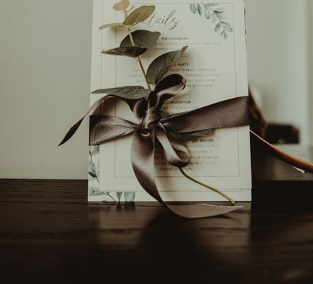 Green and White Wedding Stationery Tied with Ribbon