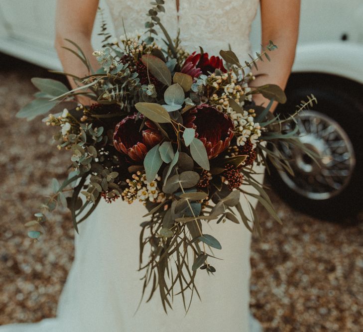 Red and Green Wedding Bouquet with Proteas and Eucalyptus