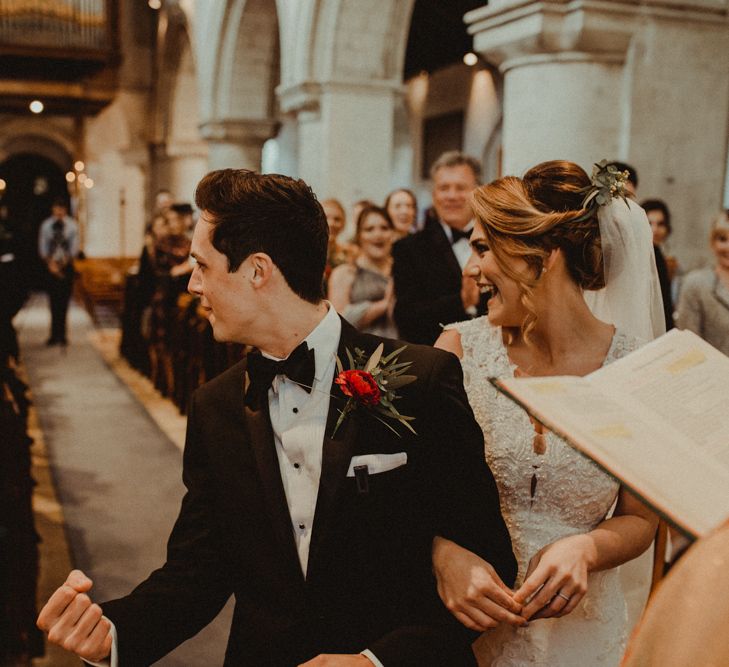 Groom in Black Tie Suit Fist pushing The Air at the Church Wedding Ceremony