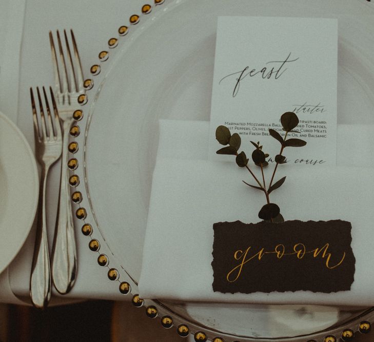 Elegant Place Setting with Glass Charger Plate, Napkin, Name Place Card and Foliage Stem