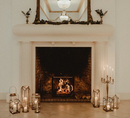 Fireplace Decorated with Candles, Lanterns and Candelabras