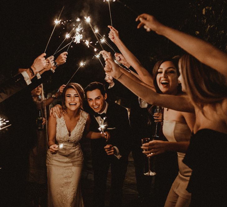 Sparkler Exit with Bride in Lace Wedding Dress and Groom in Black Tie Suit