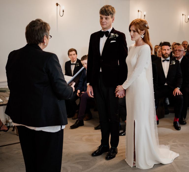 Bride and groom exchanging vows at Aswarby Recetory wedding venue