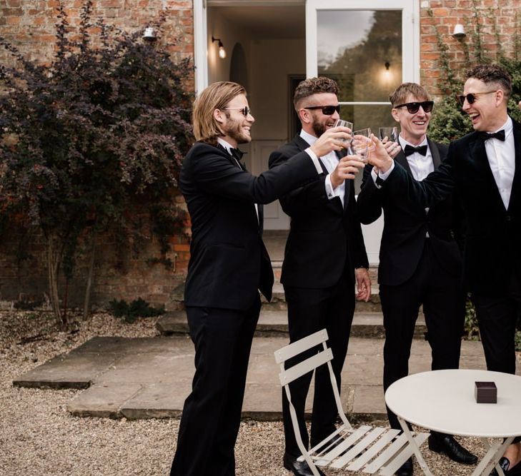 Groomsmen in black tuxedos at Aswarby Rectory wedding