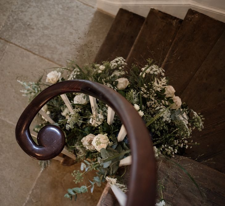 Stairs at Aswarby Rectory decorated in white and green flowers