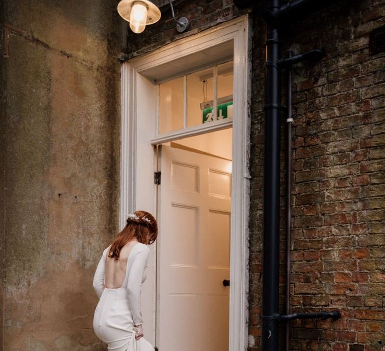 Bride in backless Alexandra Grecco wedding dress