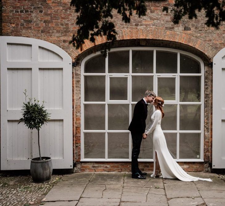 Bride and groom portrait at Aswarby Rectory with bride in Alexandra Grecco wedding dress