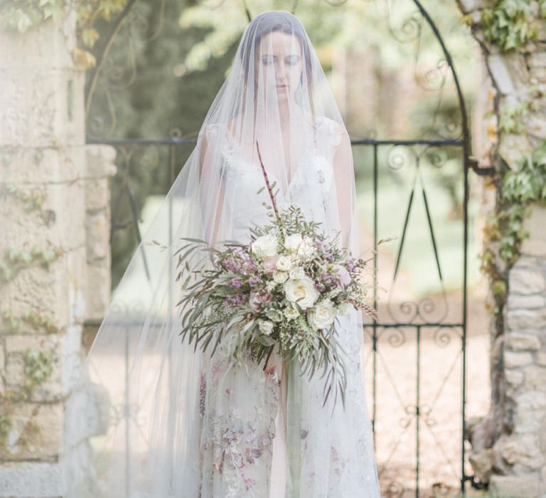 Bride in Stephanie Allin Floral Wedding Dress  and Megan Therese Couture Tulle Wedding Veil