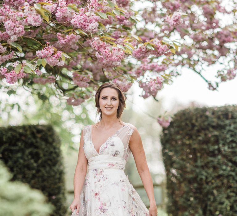 Beautiful Bride Twirling in a Floral Wedding Dress