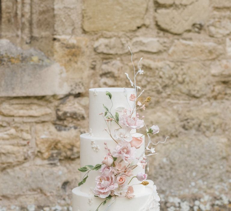 Elegant White Wedding Cake with Floral Decor