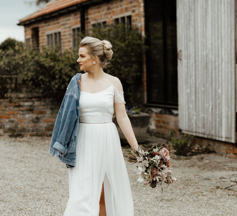 Bride in Spaghetti Strap Wedding Dress with Front Split, Boots and Denim Jacket