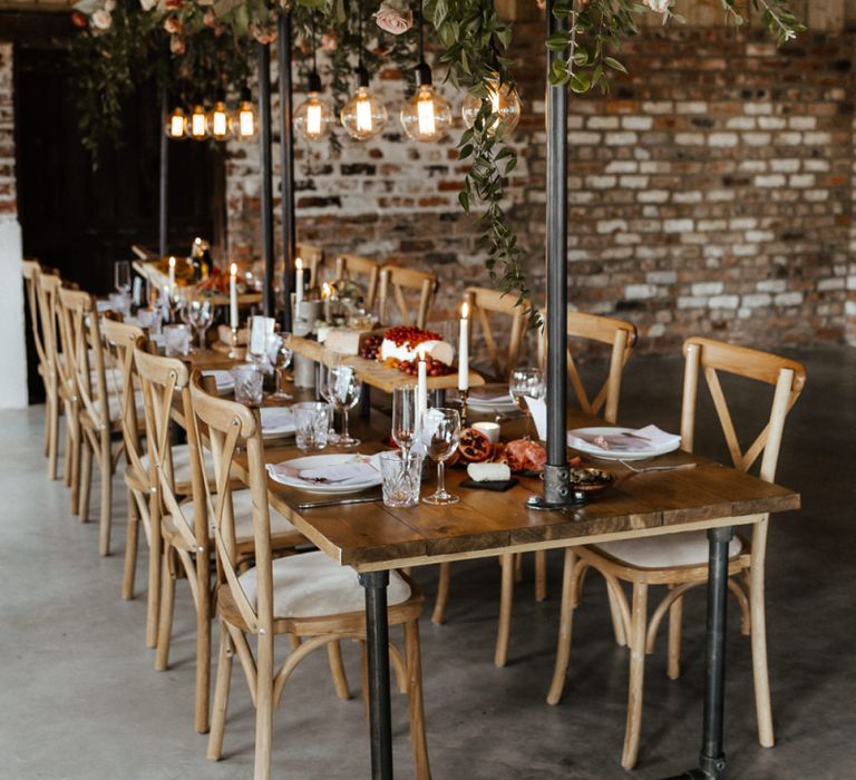 Rustic Tablescape with Edison Bulb Installation and Eco-friendly Flowers