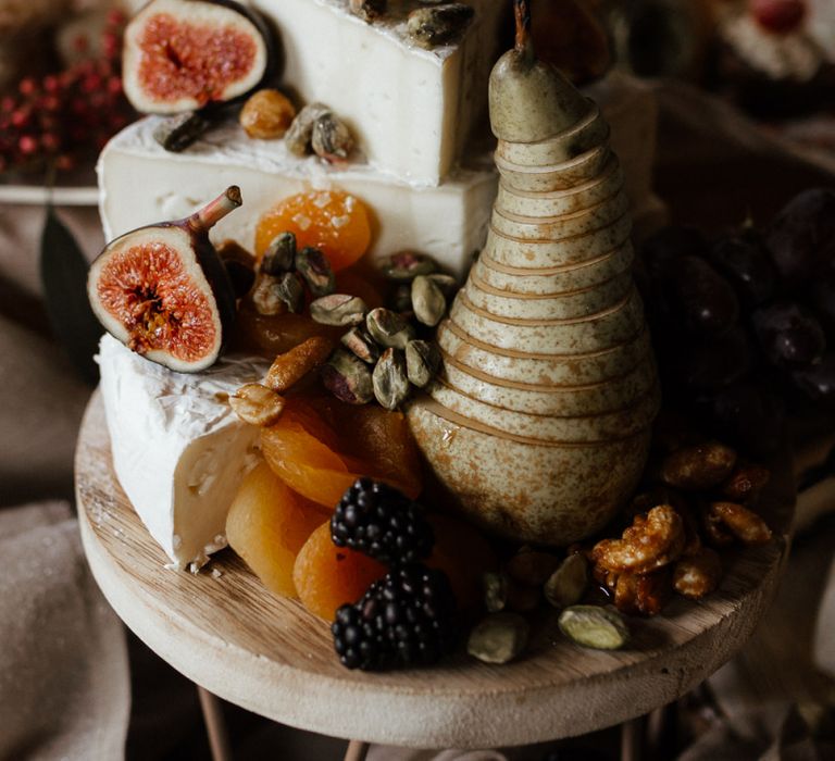 Stacked Cheese with Sliced Fruit and Berries