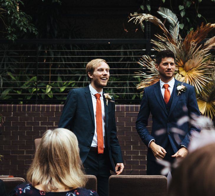 Groomsmen in Navy Suits with Orange Ties