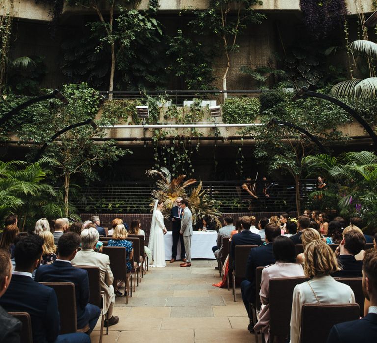 Wedding Ceremony at Barbican Conservatory in London with Botanical Plants