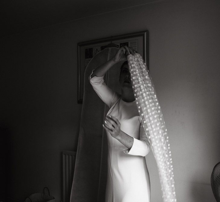 Wedding Morning with Bride Putting on Her Polka Dot Wedding Veil