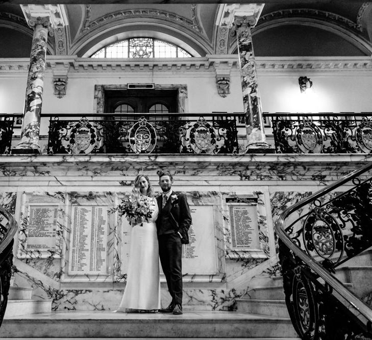 Bride in Vintage Wedding Dress and Groom in Tailored Suit  at Stockport Town Hall