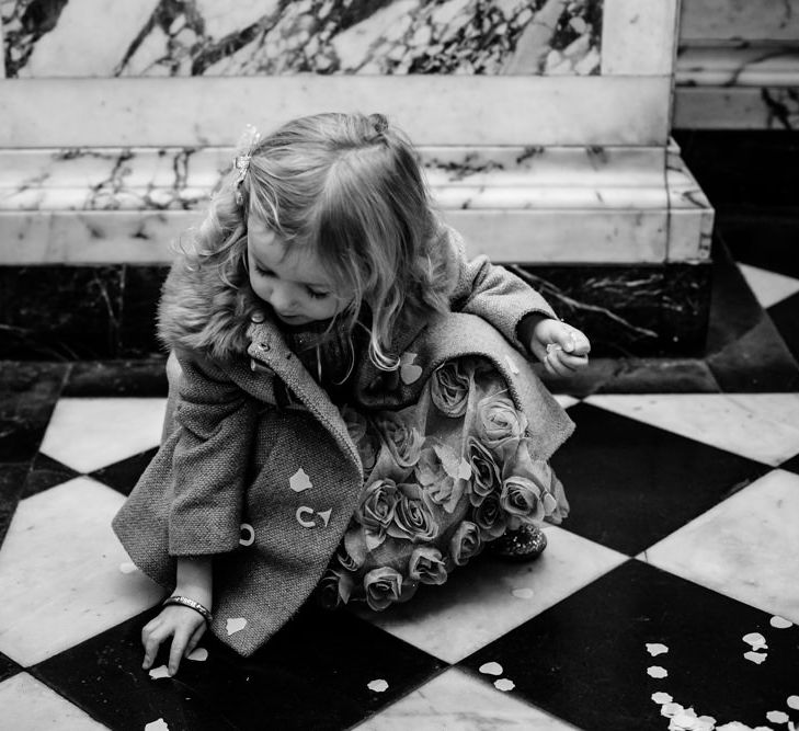 Flower Girl Picking Up Wedding Confetti