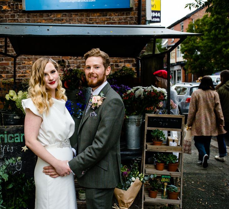 Vintage Bride with Satin Wedding Dress, Finger Waves and Red Lipstick, Holding Grooms Hand in Tailored Suit