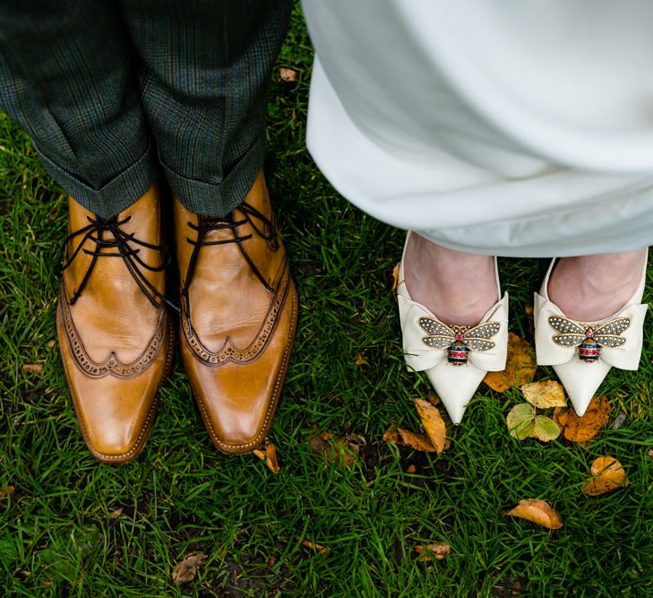 Bride in Bee Brooch Gucci Shoes and Groom in Jeffrey West Brown Brogues