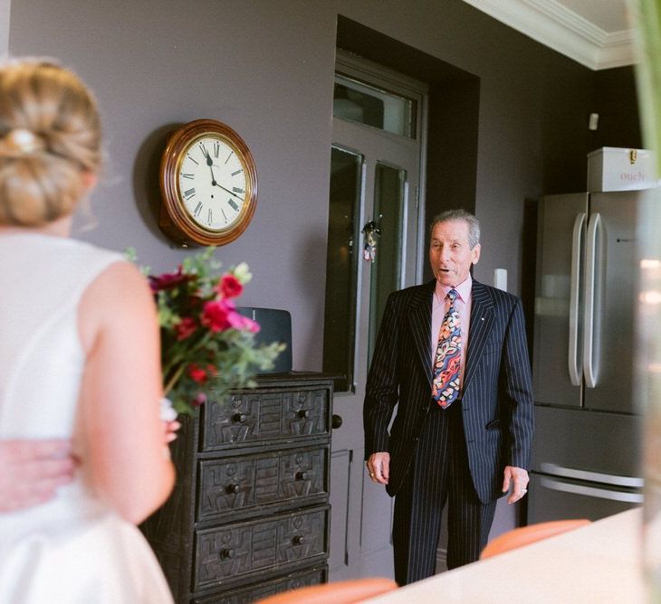 Brides father sees her for the first time in her dress