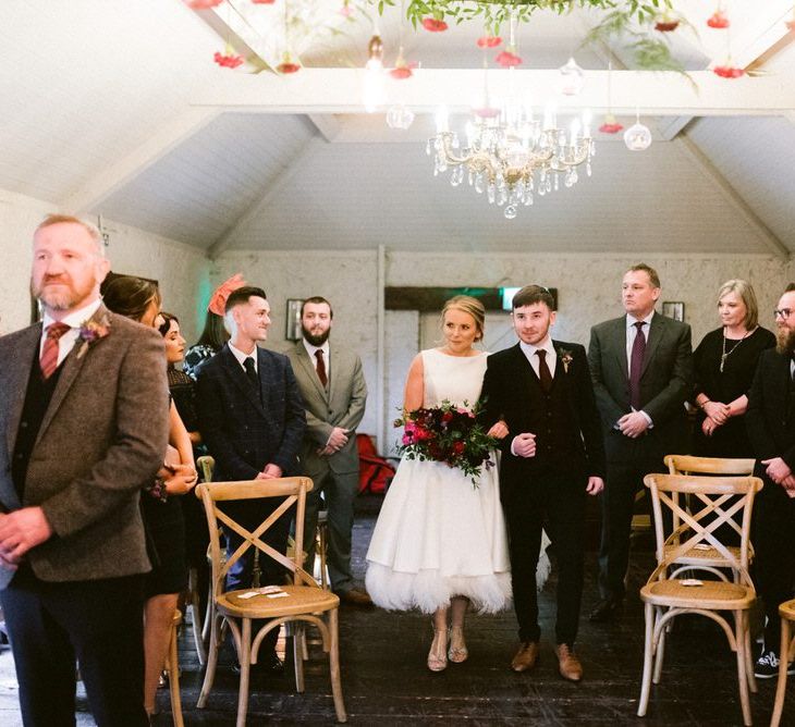 Bride enters intimate Christmas wedding ceremony