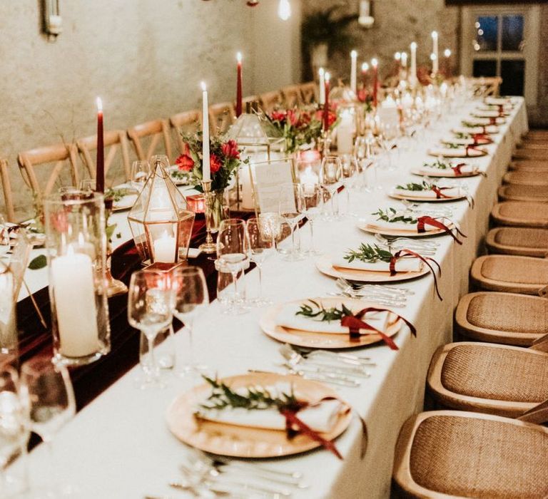 Table decor with candles and flowers at Christmas wedding