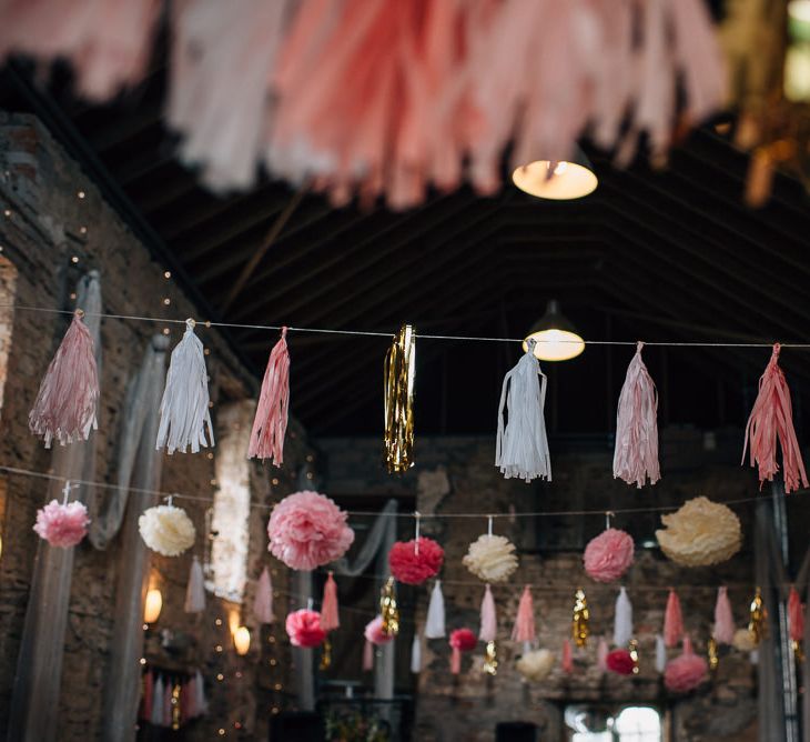 Strung Up Tissue Tassels and Pom Pots Decorating Wedding Venue