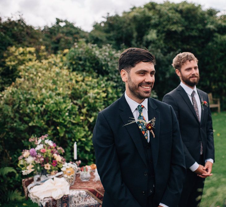 Groom Standing at The Altar in Paul Smith Suit and Liberty Print Tie