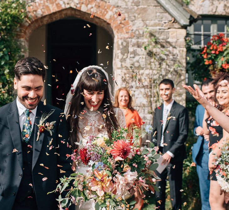 Confetti Exit with Bride in Catherine Deane Wedding Dress and Groom in Paul Smith Suit and Liberty Print Tie