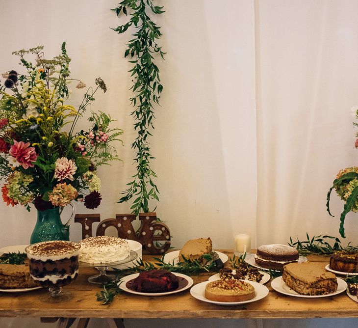 Dessert table with Wild Flower Arrangements on Large Vases