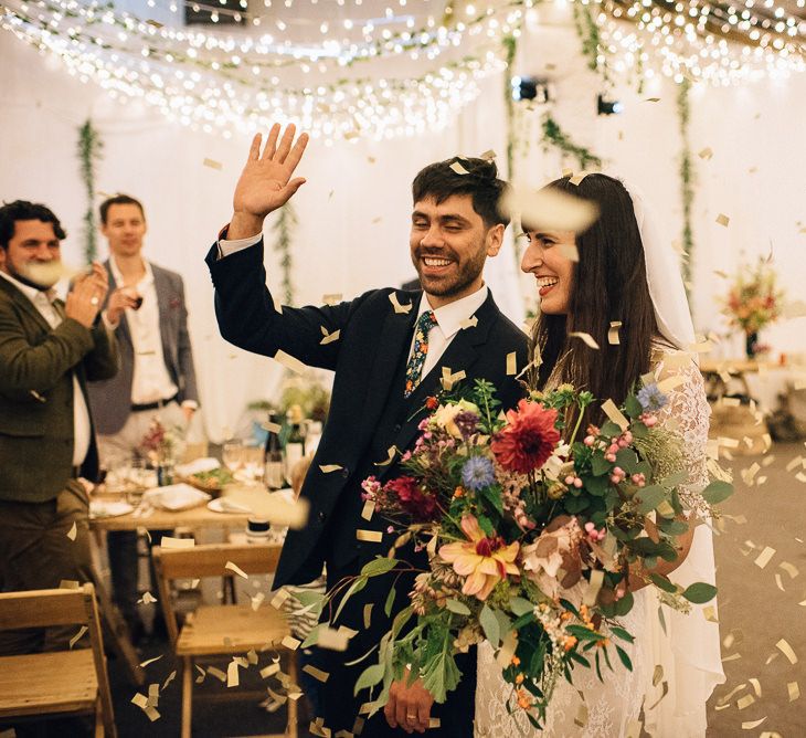 Wedding Reception Entrance with Bride in Catherine Deane Wedding Dress and Groom in Paul Smith Suit