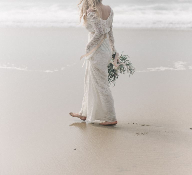 Bride in This Modern Love Bridal Lace Wedding Dress | Romantic Runaway Bride Wedding Inspiration at Chapel Porth beach in Cornwall, Styled by Boelle Events | Olivia Bossert Photography