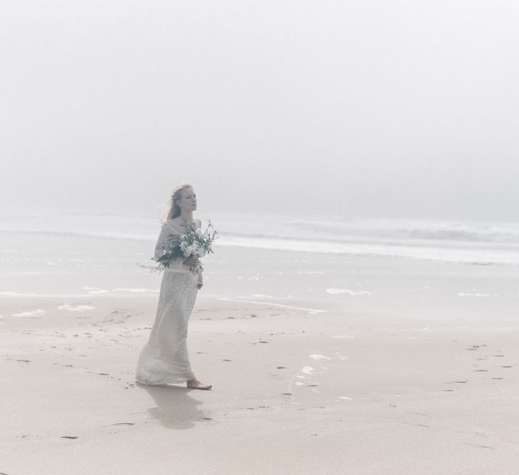 Bride in This Modern Love Bridal Lace Wedding Dress | Romantic Runaway Bride Wedding Inspiration at Chapel Porth beach in Cornwall, Styled by Boelle Events | Olivia Bossert Photography