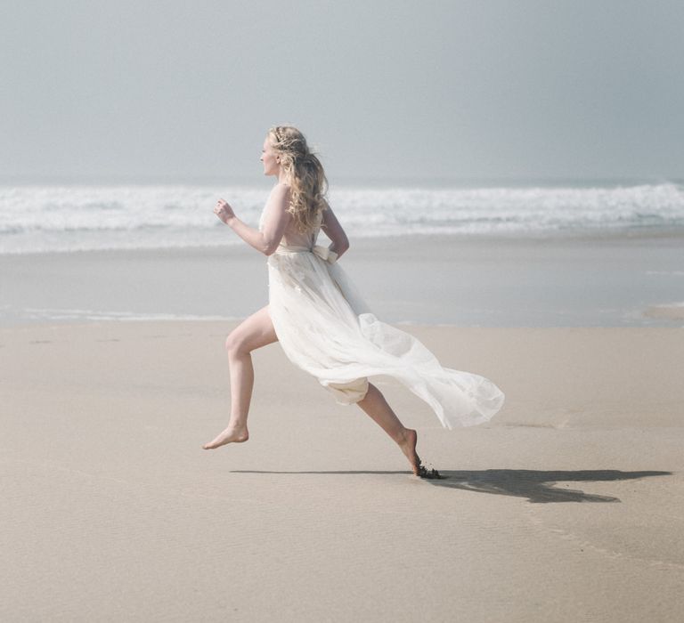 Bride in This Modern Love Bridal Lace Wedding Dress | Romantic Runaway Bride Wedding Inspiration at Chapel Porth beach in Cornwall, Styled by Boelle Events | Olivia Bossert Photography