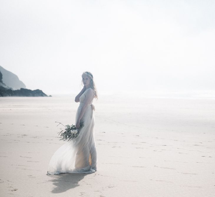 Bride in This Modern Love Bridal Lace Wedding Dress | Romantic Runaway Bride Wedding Inspiration at Chapel Porth beach in Cornwall, Styled by Boelle Events | Olivia Bossert Photography